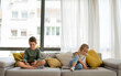 © NDABCREATIVITY - Portrait of happy children using digital devices and having fun together.