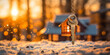 Golden winter sunrise illuminates a house-shaped key, evoking the warmth of a cozy home amidst a snowy landscape, symbolizing homeownership dreams