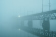Train approaching on the Amtrak Susquehanna River Bridge on a foggy evening in Havre de Grace, Maryland