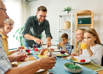 senior mature elderly couple active family lunch food woman meal eating mother dinner father grandfather grandmother home table parent grandparent