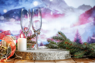 Wall Mural - Champagne glasses on wooden table and empty space for your product. Winter landscape of mountains. New year time and mockup for your decoration. 