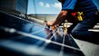 © Werckmeister - Close up of hand of mature Technician man touching solar panels on house roof for self consumption energy. Renewable energies and green energy concept