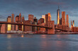 Classic New York skyline with Brooklyn bridge at sunrise