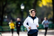 © Andrii Zastrozhnov - Woman engaging in outdoor fitness and running, showcasing a healthy and active lifestyle in a park setting.
