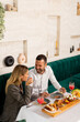 © BGStock72 - Young couple having lunch and drinking fresh squeezed juice in the restaurant