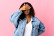 Teenager cuban girl isolated on pink background covering eyes by hands. Do not want to see something