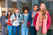 © Monkey Business - Portrait Showing Class Of Secondary Or High School Pupils Standing Outside School Building