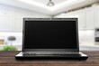 © BillionPhotos.com - Modern laptop with black blank screen on desk