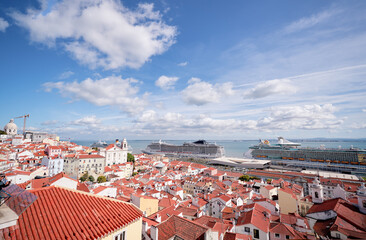 Sticker - Beutiful view of old town in Lisbon. Red tiled roofs and blue sky.