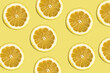 lemmon pattern on bright yellow background. Minimal flat lay food texture. Summer abstract trendy fresh concept.