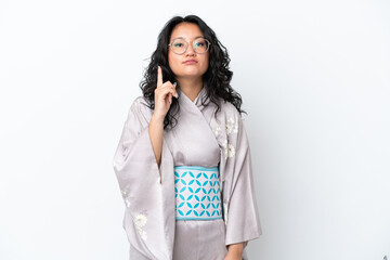 Young asian woman wearing kimono isolated on white background pointing with the index finger a great idea