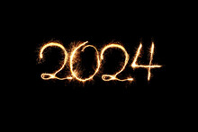 New Year 2024 sparkler golden light. Sparklers draw figures 2024. Bengal lights and letter. Holidays 2024 card.