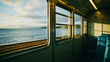 View from inside of train. Window outlooking the sea. Cinematographic effect.