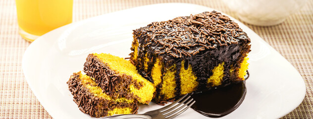 Sticker - sliced ​​carrot cake with chocolate sprinkles, creamy icing running down the cake, traditional sweet from Brazil