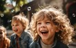 © piai - A group of kids blowing bubbles interact each other in the park