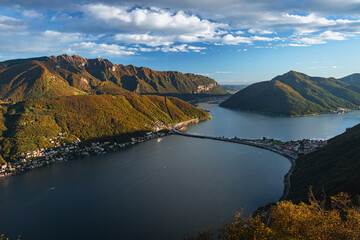 Wall Mural - The sunset and the landscape seen from Mount San Salvatore at the end of an autumn day, near the town of Lugano, Ticino, Switzerland - 31 October 2023.