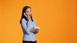 Asian woman using landline phone for remote call, talking to someone on vintage telephone line. Confident person answering office phone with cord, communicating remotely in studio.