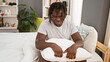 © Krakenimages.com - African american man stressed sitting on bed at bedroom