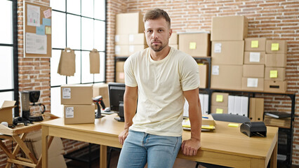 Poster - Young man ecommerce business worker standing with relaxed expression at office