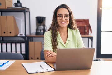 Sticker - Young hispanic woman working at the office wearing glasses with a happy and cool smile on face. lucky person.