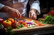 © Jan - Chef slicing fresh vegetables on a wooden board in a restaurant kitchen