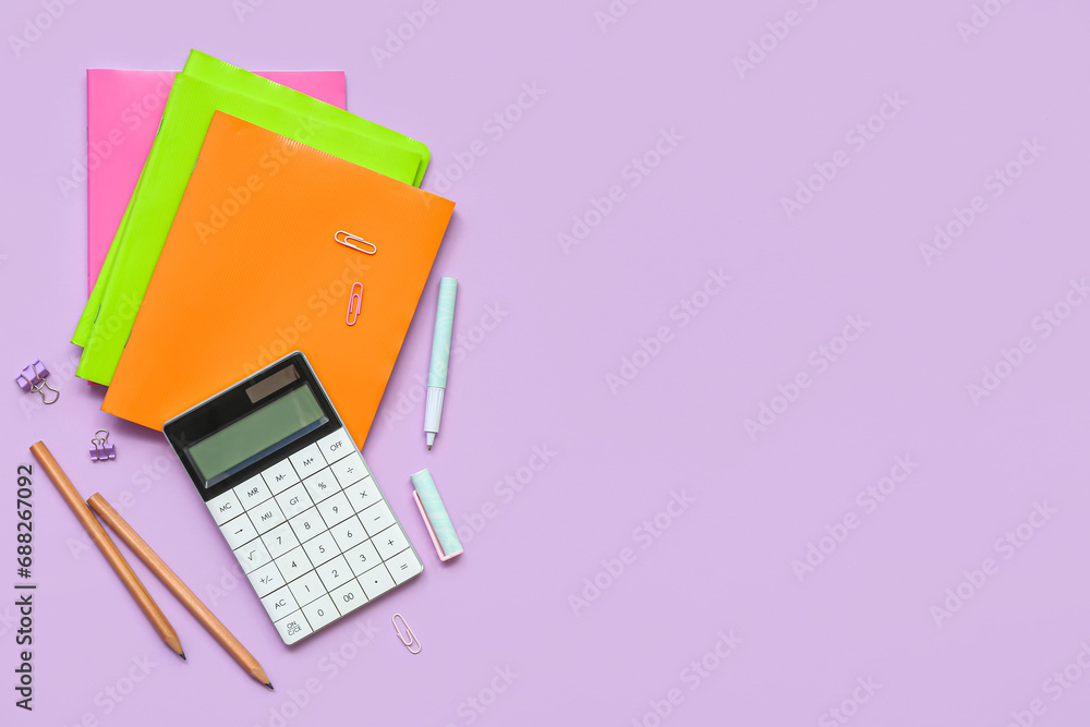 Composition with school supplies on lilac background