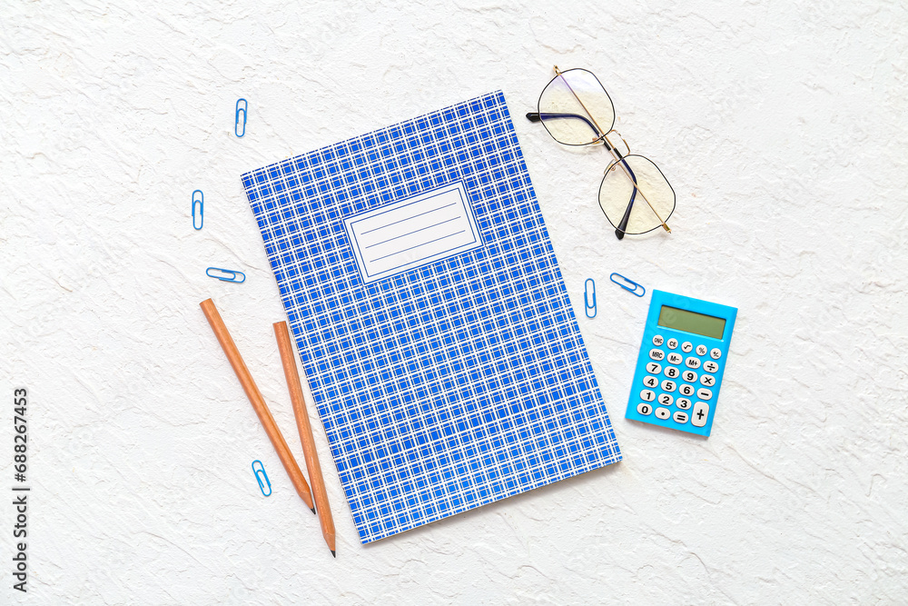 Composition with stationery and eyeglasses on light background