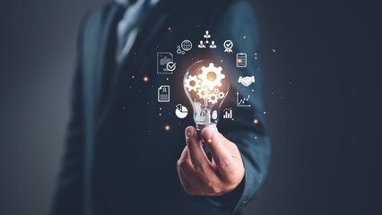 Wall Mural - hand holding light bulb, global internet connection cloud computing. business global internet connec
