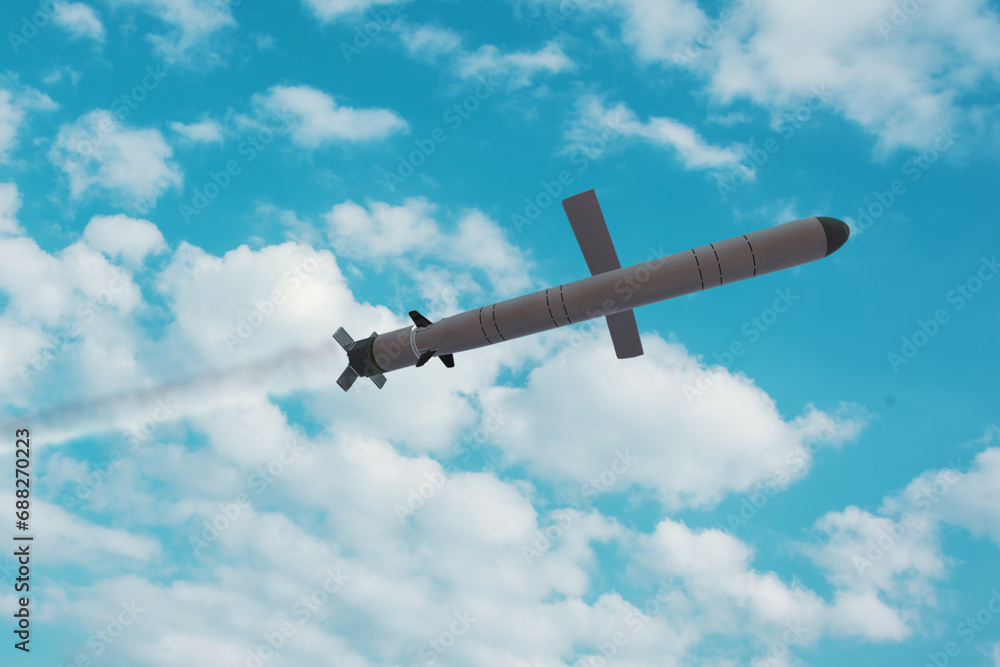 Kalibr cruise missile flies in the sky, smoke trail from the launch of the missile. Concept: war in Ukraine, Russian missile attack, airborne Subway.
