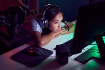 Wall Mural - Young beautiful hispanic woman streamer stressed using computer at gaming room