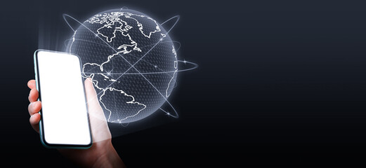 Wall Mural - global network. woman holding smartphone with digital image of earth on black background. banner des