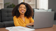 © Krakenimages.com - African american woman call center agent smiling working at home