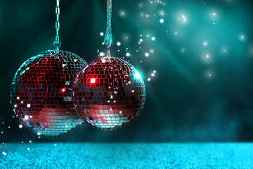 Poster - Shiny disco balls on dark cyan background with blurred lights, space for text. Bokeh effect