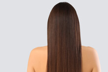 Young Brunette Woman With Beautiful Hair On Light Background, Back View