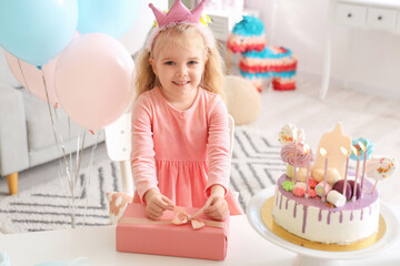 Sticker - Cute little girl with gift celebrating Birthday at home