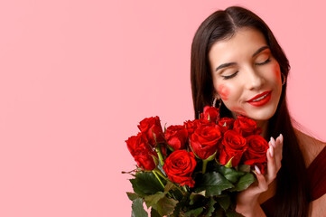 Poster - Beautiful young woman with kiss marks on her face and bouquet of roses on pink background