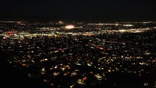A Drone UAV Aerial View Of The Night Lights Above Palm Springs And Palm Desert, California