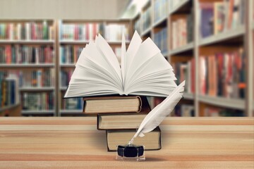 Wall Mural - Old books and retro quill pen in library.