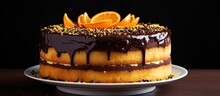 Orange Cake With Chocolate Ganache And Sprinkles.