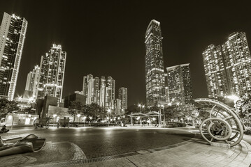 Poster - Public park and skyscraper in downtown district of Hong Kong city at night