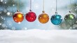  a group of christmas ornaments hanging from strings on a string in the snow with a boke of snowflakes in the background.