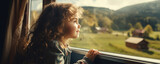 Fototapeta  - Little girll in train lookin from window at nature land. Children travel in train concept.