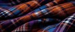 Close-up of Scottish wool fabric with brown checkered pattern and vibrant colored threads, suitable for plaid coat and suit. Background.
