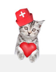 Sticker - Cat dressed like a doctor holds red heart above empty white banner. isolated on white background