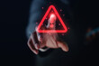 © Treecha - Businessman uses laptop computer with warning triangle sign or exclamation mark for error notification and technology maintenance concept.