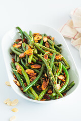 Wall Mural - Green beans with almonds and lemon. Vegan version of holiday recipe.
