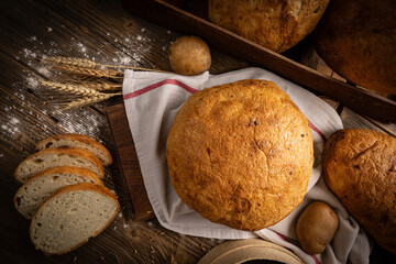 Wall Mural - Artisan whole and sliced sourdough bread