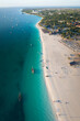 Aerial view of Zanzibar beach where tourists and locals mix together of colors and joy, concept of summer vacation, aerial view of Kendwa beach, Tanzania