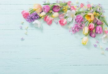 Wall Mural - spring flowers on blue  wooden background