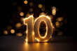 © Kassiopeia  - Golden sparkling number ten on black background. Symbol 10. Invitation for a tenth birthday party or business anniversary.